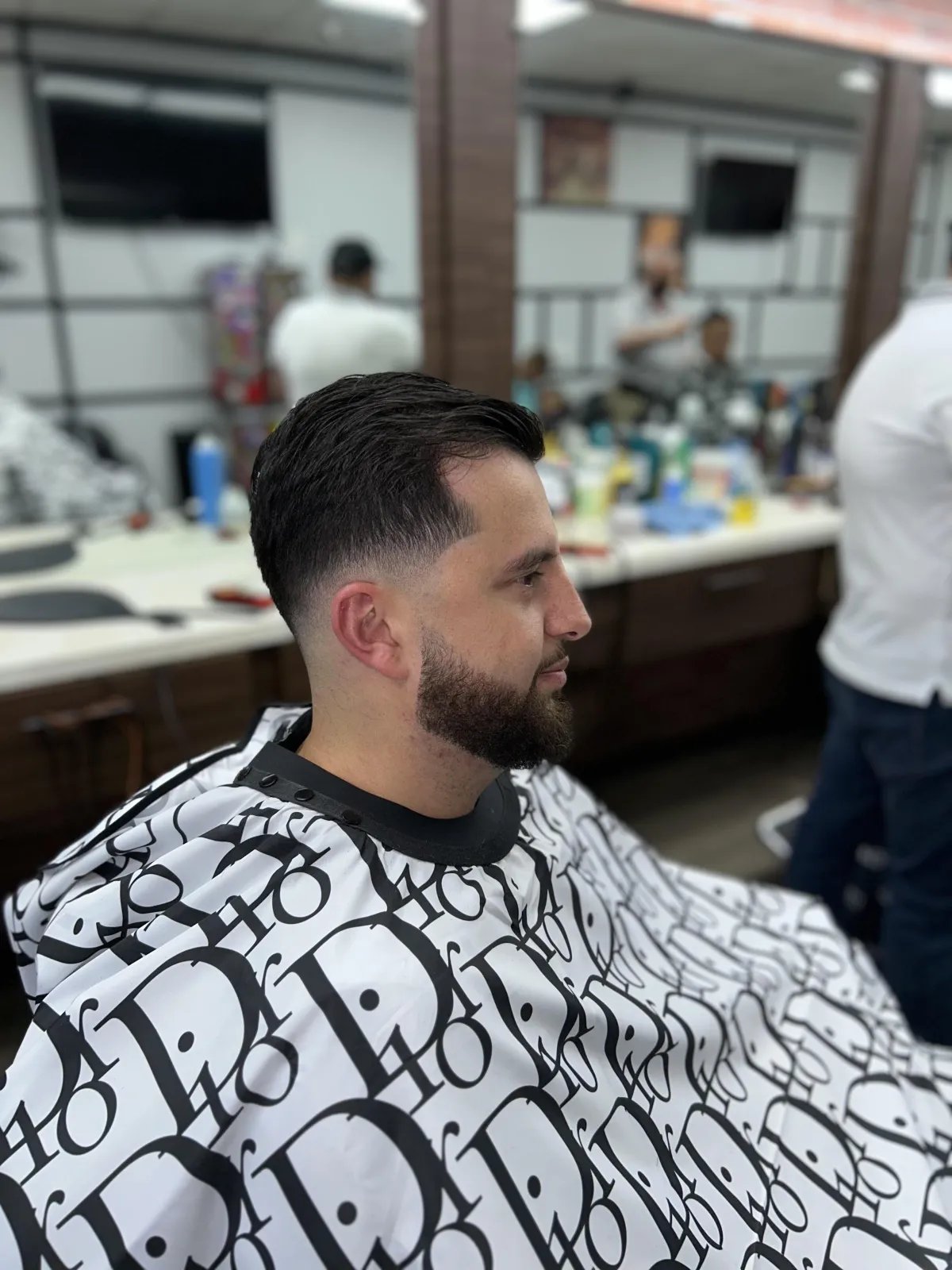 Client with a full beard shaped and lined up at Plaza Barber Shop