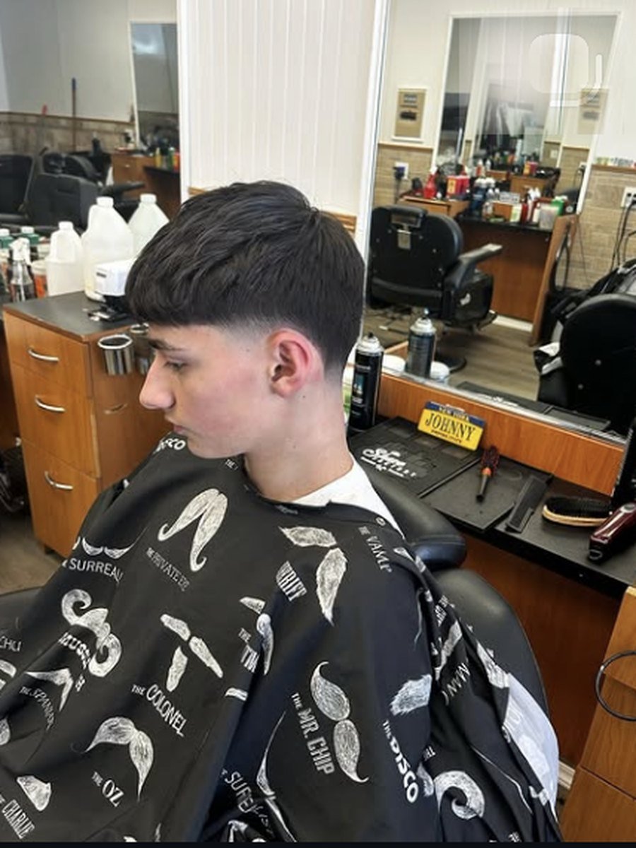 Modern bowl crop with a clean taper at Plaza Barber Shop West Hempstead