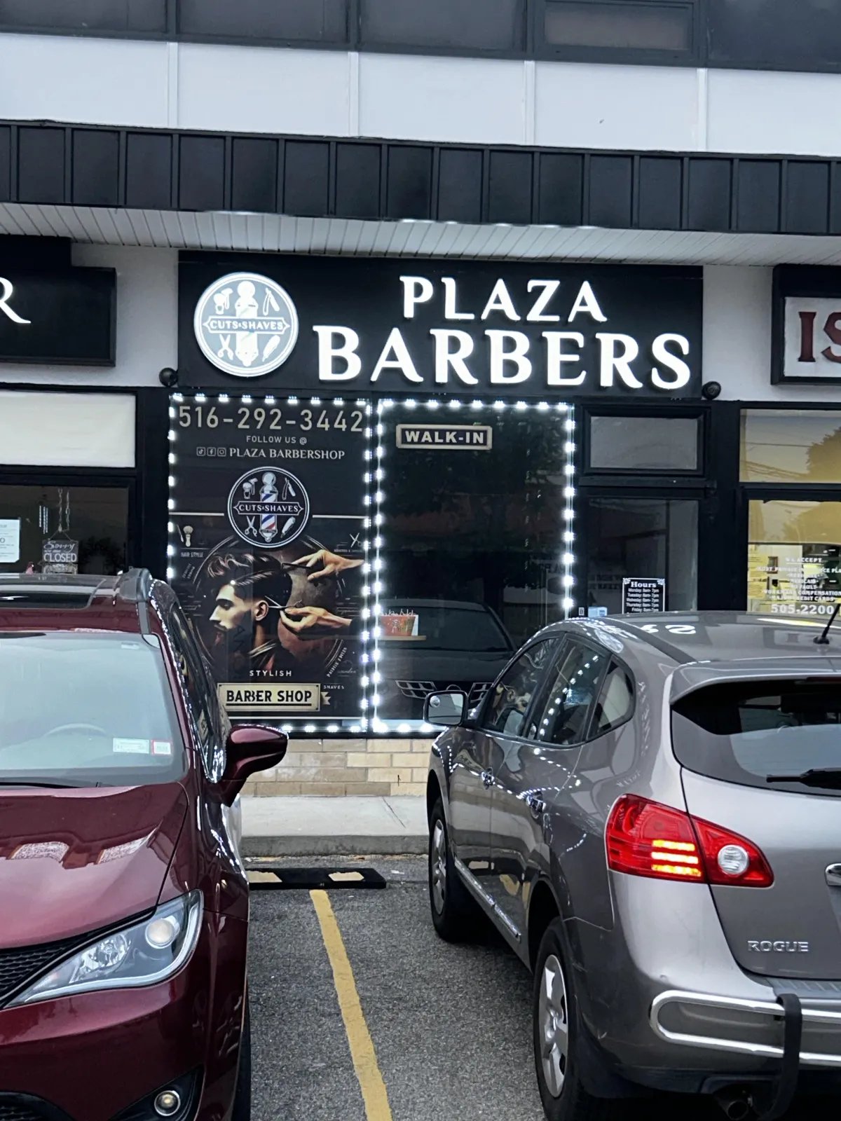 The Plaza Barbers storefront sign at 300 Hempstead Turnpike, West Hempstead