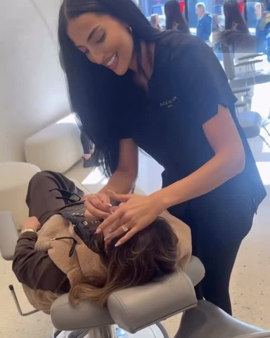 Brow artist working on a client reclined in the Toorak studio